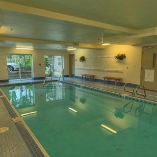 A serene indoor swimming pool area designed for relaxation and fitness.