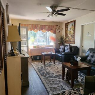A cozy living room with comfortable seating and elegant decor.