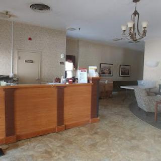 A welcoming lobby area featuring a reception desk and cozy seating.