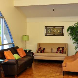 A cozy living room with comfortable seating and warm decor.