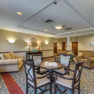 A well-decorated lobby with comfortable seating and elegant furniture.