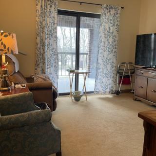 A cozy living room with comfortable seating and a TV.