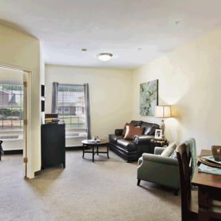 A cozy living room with comfortable seating and natural light.