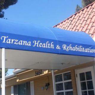 Entrance of Tarzana Health & Rehabilitation with a blue awning.