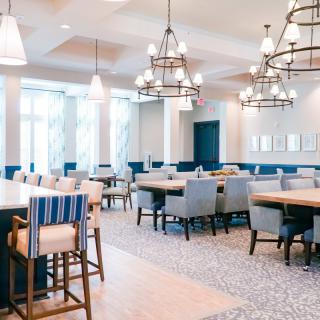 A modern dining area with stylish decor and ample seating.