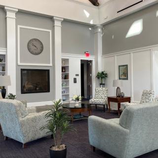 A spacious and modern lobby featuring comfortable seating, elegant decor, and a cozy atmosphere.