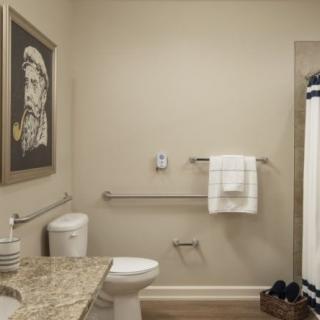 A well-organized, accessible bathroom with a shower and modern decor.
