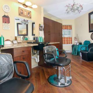 A cozy hair salon with comfortable chairs and stylish decor.