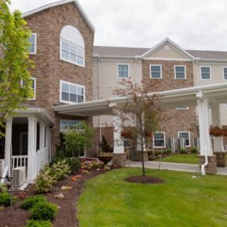 A well-maintained residential building with a landscaped garden.