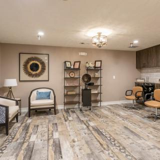 A modern living room with stylish furniture and decorative elements.