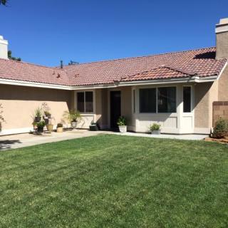 A suburban house with a well-maintained front yard and garden.
