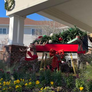 A beautifully decorated sleigh with festive greenery, ready for the holiday season.