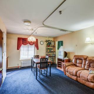 Cozy living room area featuring a comfortable couch and dining table.