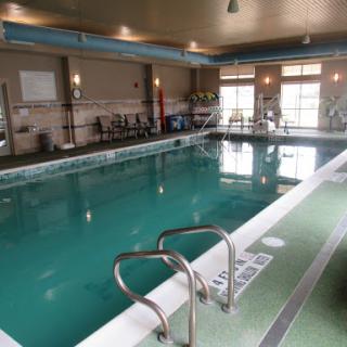 A serene indoor swimming pool, perfect for relaxation and fitness activities.