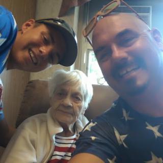 A warm moment captured in a family selfie with a lovely elder.