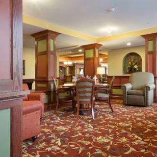 A cozy hotel lobby featuring comfortable seating, elegant decor, and a welcoming atmosphere.