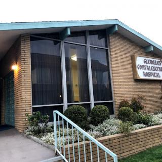 A community hospital with a welcoming entrance and well-maintained landscaping.