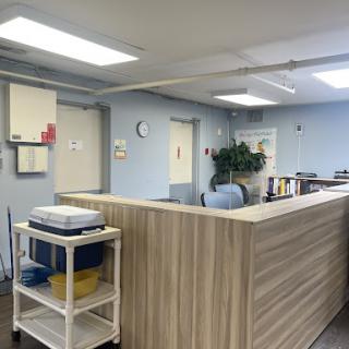 A spacious and organized office reception area with modern furnishings and a welcoming atmosphere.