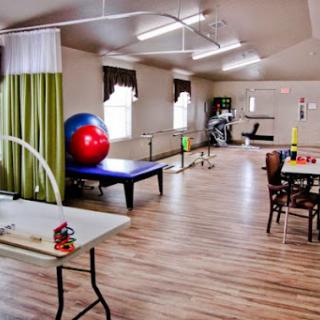 A spacious rehabilitation center equipped with exercise tools and a bright, welcoming atmosphere.