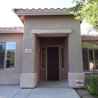 Front entrance of a residential home with a covered porch.