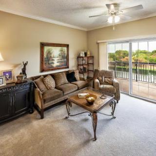 A cozy living room featuring comfortable furniture and a beautiful view.