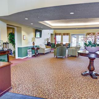 A spacious lobby with comfortable seating and elegant decor.