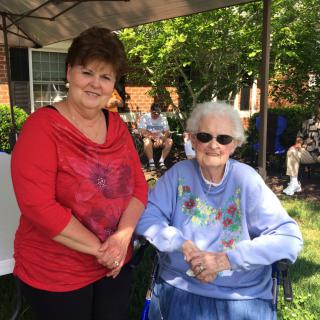 Two women enjoying a sunny day in the garden.