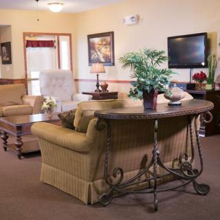 A cozy living room with comfortable seating and elegant decor.