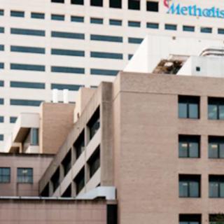 A view of a hospital building with distinct architectural design.