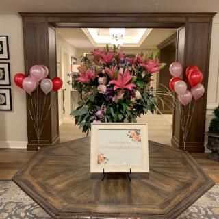 A vibrant display of flowers and balloons, perfect for a celebratory event.
