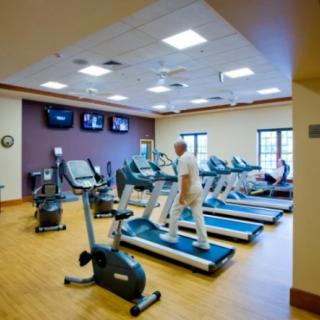 A fitness center with treadmills and exercise equipment.