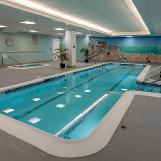 A serene indoor swimming pool designed for relaxation and fitness.