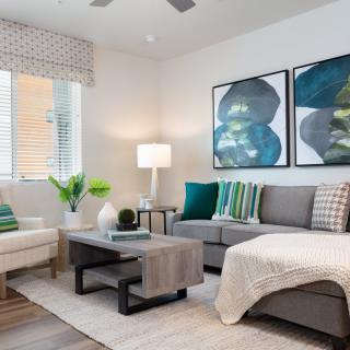 A modern and cozy living room with stylish furniture and decor.