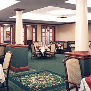A well-decorated restaurant dining area with tables and chairs arranged neatly.