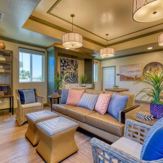 A cozy and modern living room with stylish furniture and warm lighting.