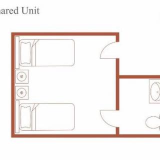 A floor plan layout of a shared living unit featuring two beds and a bathroom.