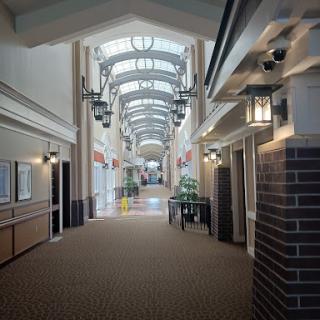 A spacious and well-lit commercial hallway featuring modern architectural design.