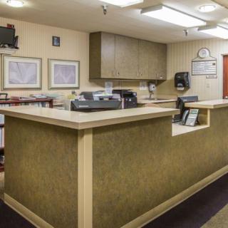 Reception area with a front desk and office decor.