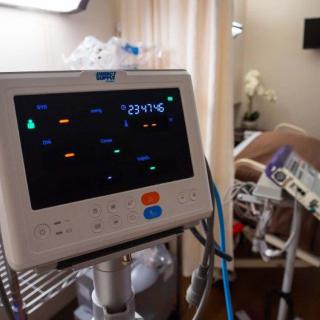A hospital room featuring medical monitoring equipment.