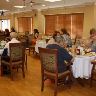 A group of people dining together in a restaurant setting.