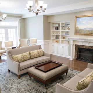 A beautifully designed living room featuring elegant furniture and a cozy fireplace.