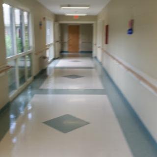A clean and well-lit hallway in a medical facility.