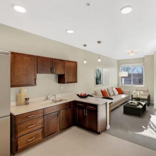 A modern open-concept kitchen and living room with elegant decor.