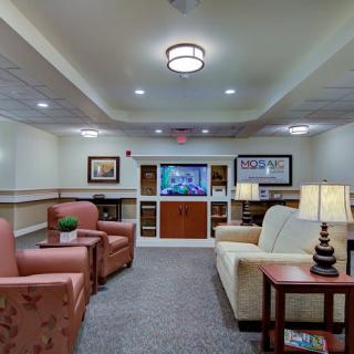 A cozy living room with comfortable seating and a television.