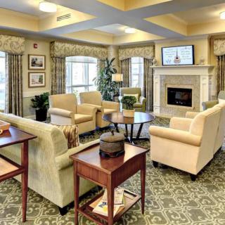 A cozy living room with elegant furniture and a fireplace.