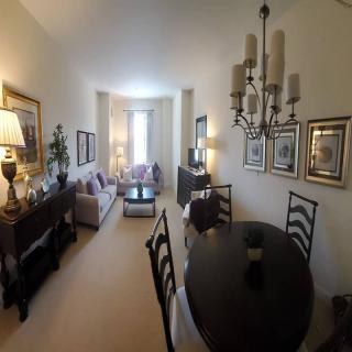 A cozy living and dining space with elegant furnishings and decor.