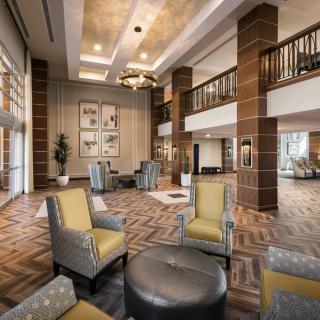 A modern hotel lobby with stylish furniture and elegant lighting.