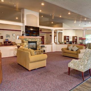 A cozy lobby featuring comfortable seating and a modern aesthetic.