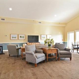 A cozy living room with comfortable seating and abundant natural light.