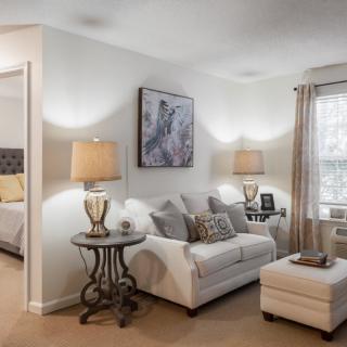 A cozy living room with elegant furniture and soft lighting.